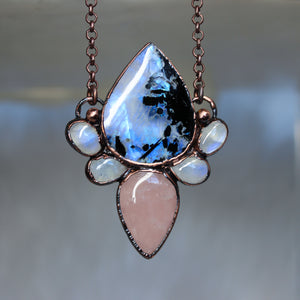 A fantasy style crystal necklace made with Moonstone and Rose Quartz.